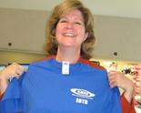 Terri Quinn shows off her Employee of the Day (EOTD) T-Shirt 